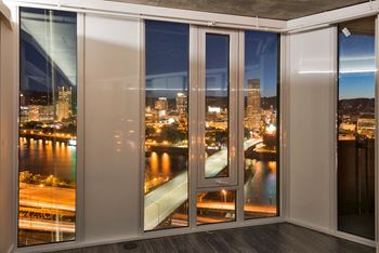 Yard apartments living room with floor to ceiling windows